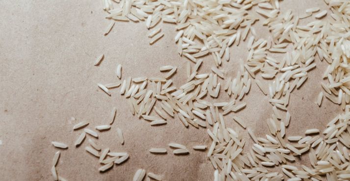 rice grains on a brown surface
