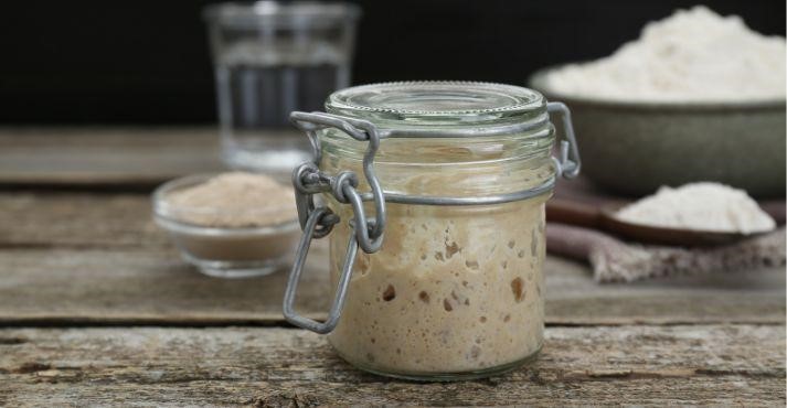 Bread-base-mixed-with-leavening-agent-rising-in-mason-jar
