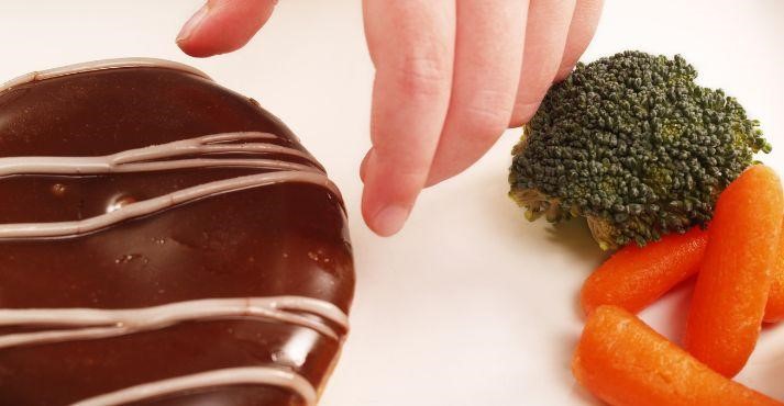 Consumer-eating-habits-evolving-choice-between-donut-and-vegetables